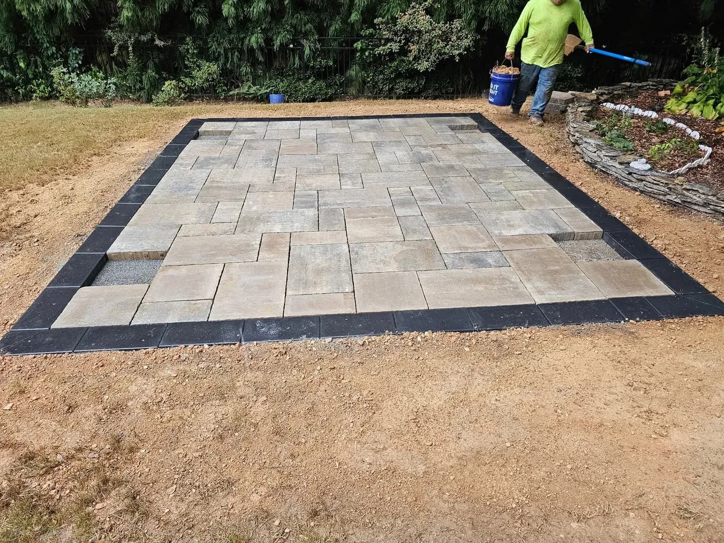 Rectangular Paver Patio with Border by Alex's Lawnscape in Charlotte NC — Clean rectangular paver patio with dark border edging in a multi-tone natural stone pattern