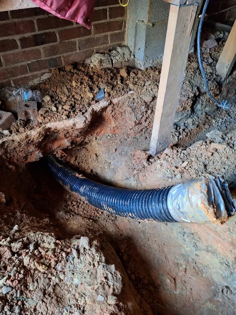 Natural Stone Water Feature by Alex's Lawnscape in Charlotte NC — Finished cascading rock waterfall feature with river stones alongside a flagstone walkway
