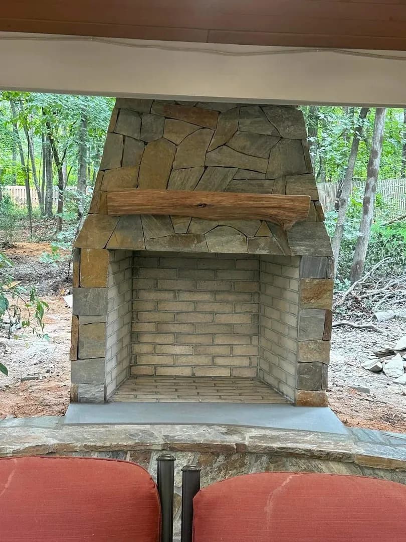 Custom outdoor fireplace with stone surround Charlotte NC